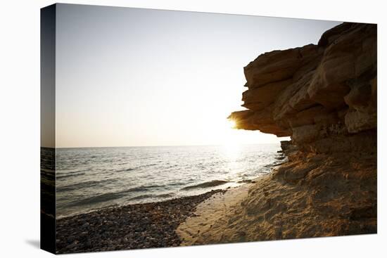 Sundown on the stone beach island Kos, Greece,-Rasmus Kaessmann-Stretched Canvas