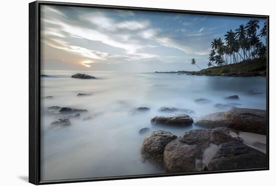 Sunrise at a Secluded Lagoon with Rocks and Palm Trees Framing the View-Charlie-Framed Photographic Print