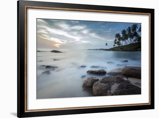 Sunrise at a Secluded Lagoon with Rocks and Palm Trees Framing the View-Charlie-Framed Photographic Print