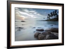 Sunrise at a Secluded Lagoon with Rocks and Palm Trees Framing the View-Charlie-Framed Photographic Print