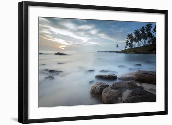 Sunrise at a Secluded Lagoon with Rocks and Palm Trees Framing the View-Charlie-Framed Photographic Print