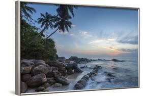 Sunrise at a Secluded Lagoon with Rocks and Palm Trees Framing the View-Charlie-Framed Photographic Print