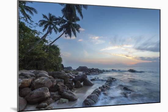 Sunrise at a Secluded Lagoon with Rocks and Palm Trees Framing the View-Charlie-Mounted Photographic Print