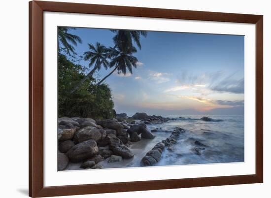 Sunrise at a Secluded Lagoon with Rocks and Palm Trees Framing the View-Charlie-Framed Photographic Print