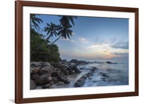 Sunrise at a Secluded Lagoon with Rocks and Palm Trees Framing the View-Charlie-Framed Photographic Print