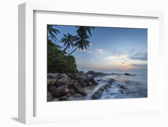 Sunrise at a Secluded Lagoon with Rocks and Palm Trees Framing the View-Charlie-Framed Photographic Print