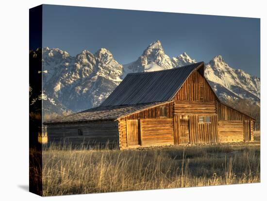 Sunrise at the Mormon Row Barn in Wyoming's Grand Teton National Park-Kyle Hammons-Stretched Canvas