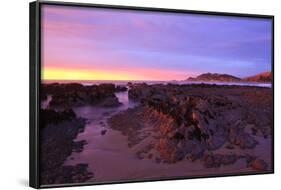 Sunrise Casts a Red Pink Hue on Rocks of a Beach Looking Towards Nugget Point-Eleanor-Framed Photographic Print