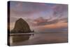 Sunrise clouds over Haystack Rock in Cannon Beach, Oregon, USA-Chuck Haney-Stretched Canvas