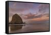 Sunrise clouds over Haystack Rock in Cannon Beach, Oregon, USA-Chuck Haney-Framed Stretched Canvas