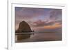 Sunrise clouds over Haystack Rock in Cannon Beach, Oregon, USA-Chuck Haney-Framed Photographic Print