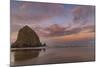 Sunrise clouds over Haystack Rock in Cannon Beach, Oregon, USA-Chuck Haney-Mounted Photographic Print