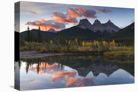 Sunrise in autumn at Three Sisters Peaks near Banff National Park, Canmore-Jon Reaves-Stretched Canvas