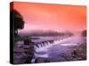 Sunrise in the morning mist over the waterfall on the Venta River near Kuldiga, Latvia-Janis Miglavs-Stretched Canvas