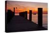 Sunrise on the Water with an Empty Dock and a Sailboat in the Distance of Tilghman Island, Maryland-Karine Aigner-Stretched Canvas