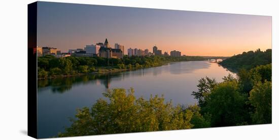 Sunrise over South Saskatchewan River and Saskatoon Skyline, Saskatchewan, Canada-null-Stretched Canvas