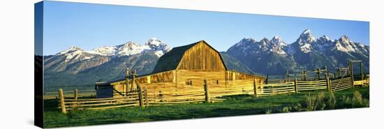 Sunrise over the Moulton Barn Along Mormon Row, Teton Range, Mormon Row Historic District-null-Stretched Canvas