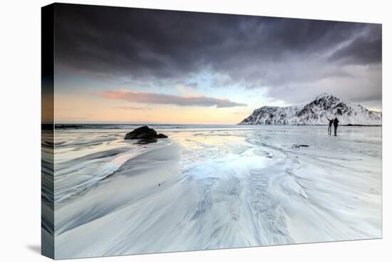 Sunset and Hikers on Skagsanden Beach Surrounded by Snow Covered Mountains-Roberto Moiola-Stretched Canvas