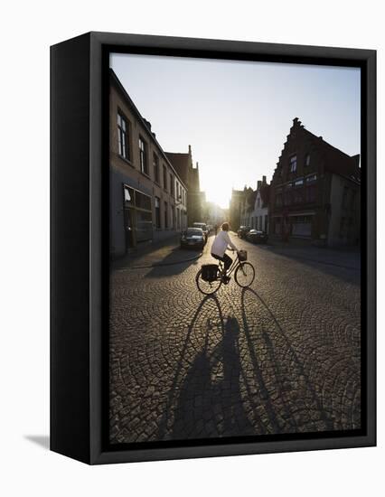 Sunset and Shadow of a Cyclist on Cobbled Street, Old Town, UNESCO World Heritage Site, Bruges-Christian Kober-Framed Stretched Canvas