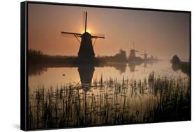 Sunset and Silhouetted Windmills Reflected in the Canals Kinderdijk-Darrell Gulin-Framed Stretched Canvas