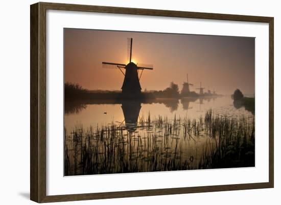 Sunset and Silhouetted Windmills Reflected in the Canals Kinderdijk-Darrell Gulin-Framed Photographic Print