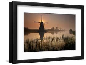 Sunset and Silhouetted Windmills Reflected in the Canals Kinderdijk-Darrell Gulin-Framed Photographic Print