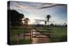 Sunset at the Gate of a Bonito Farm, with Rolling Hills in the Background-Alex Saberi-Stretched Canvas