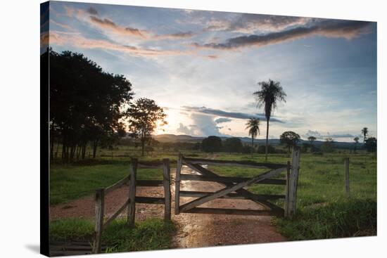 Sunset at the Gate of a Bonito Farm, with Rolling Hills in the Background-Alex Saberi-Stretched Canvas