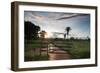 Sunset at the Gate of a Bonito Farm, with Rolling Hills in the Background-Alex Saberi-Framed Premium Photographic Print