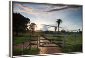 Sunset at the Gate of a Bonito Farm, with Rolling Hills in the Background-Alex Saberi-Framed Photographic Print