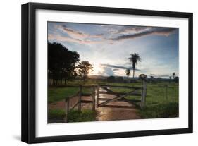 Sunset at the Gate of a Bonito Farm, with Rolling Hills in the Background-Alex Saberi-Framed Photographic Print