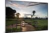 Sunset at the Gate of a Bonito Farm, with Rolling Hills in the Background-Alex Saberi-Mounted Photographic Print