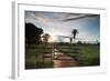 Sunset at the Gate of a Bonito Farm, with Rolling Hills in the Background-Alex Saberi-Framed Photographic Print