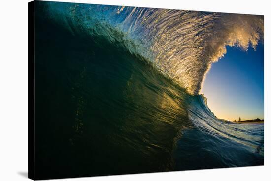 Sunset back lights a tubing wave-Mark A Johnson-Stretched Canvas