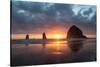 Sunset behind Haystack Rock at Cannon Beach on the Pacific Northwest coast, Oregon, United States o-Martin Child-Stretched Canvas