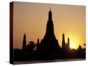 Sunset Behind Temple of Dawn on Chao Phraya River, Thailand-Merrill Images-Stretched Canvas