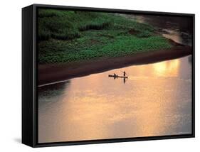 Sunset on Karo Men in a Dugout Raft, Omo River, Ethiopia-Janis Miglavs-Framed Stretched Canvas