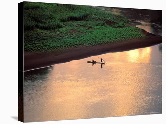 Sunset on Karo Men in a Dugout Raft, Omo River, Ethiopia-Janis Miglavs-Stretched Canvas
