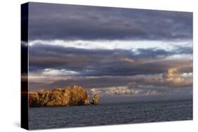 Sunset on rocky outcropping, Espanola Island, Galapagos Islands, Ecuador.-Adam Jones-Stretched Canvas