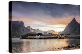 Sunset on the Fishing Village Framed by Rocky Peaks and Sea, Sakrisoya, Nordland County-Roberto Moiola-Stretched Canvas