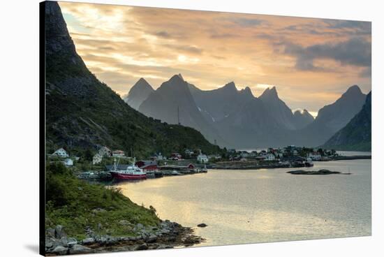 Sunset on the Fishing Village Surrounded by Rocky Peaks and Sea, Reine, Nordland County-Roberto Moiola-Stretched Canvas