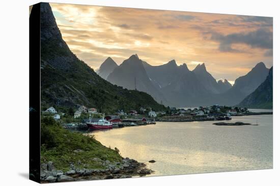 Sunset on the Fishing Village Surrounded by Rocky Peaks and Sea, Reine, Nordland County-Roberto Moiola-Stretched Canvas