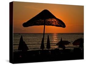 Sunset on Umbrellas, Kusadasi, Turkey-Joe Restuccia III-Stretched Canvas