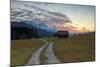 Sunset on wooden huts and meadows with the Alps in background, Geroldsee, Krun, Garmisch Partenkirc-Roberto Moiola-Mounted Photographic Print