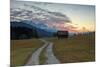 Sunset on wooden huts and meadows with the Alps in background, Geroldsee, Krun, Garmisch Partenkirc-Roberto Moiola-Mounted Photographic Print