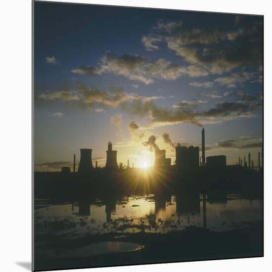 Sunset over an Oil Refinery Near Swansea, South Wales-null-Mounted Photographic Print