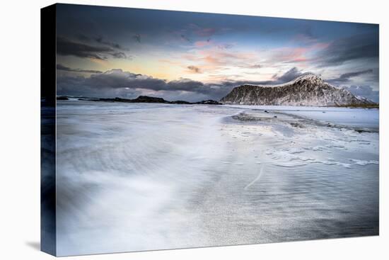 Sunset over frozen waves of the Arctic Sea, Skagsanden beach, Flakstad, Nordland county-Roberto Moiola-Stretched Canvas