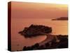 Sunset over Island of Sveti Stefan, Sveti Stefan, the Budva Riviera, Montenegro, Europe-Stuart Black-Stretched Canvas