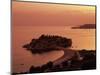 Sunset over Island of Sveti Stefan, Sveti Stefan, the Budva Riviera, Montenegro, Europe-Stuart Black-Mounted Photographic Print