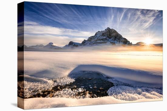 Sunset over mountains at Bow Lake in Banff, Canada during the winter with snow and blue skies-David Chang-Stretched Canvas